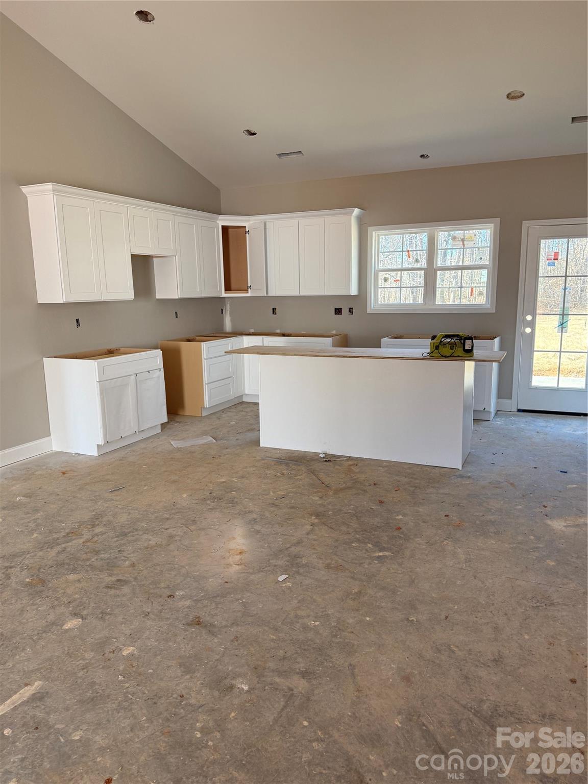 489 Merrells Lake Road Mocksville, NC 27028 - Photo 2 of 3 a large white kitchen with granite countertop a sink