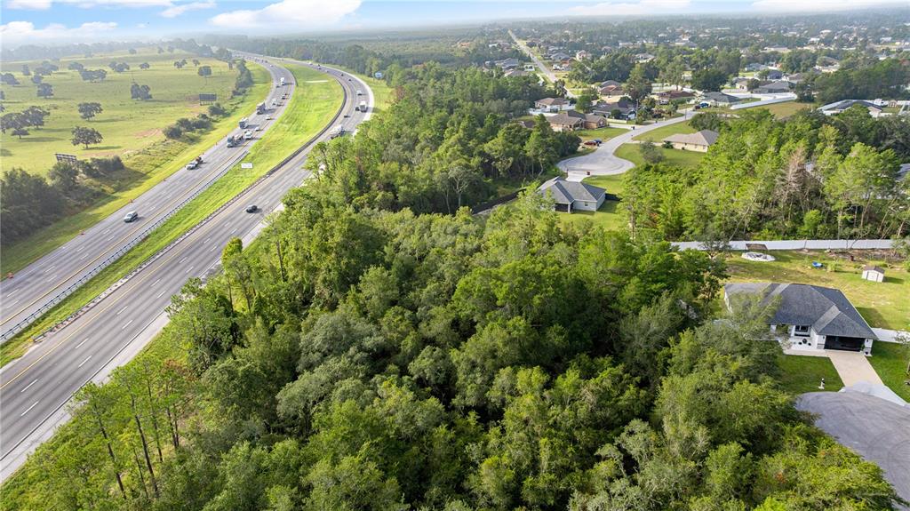 0 Southwest 92nd Lane Ocala, FL 34476 - Photo 3 of 5 an aerial view of residential houses with outdoor space and river