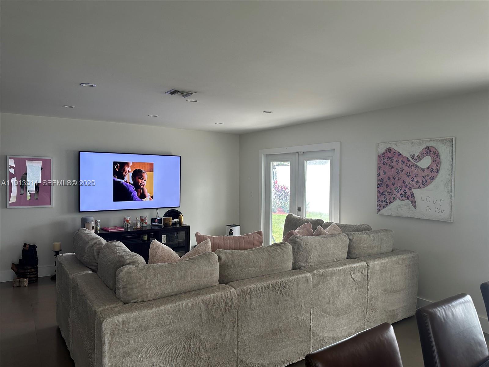11370 Southwest 113th Terrace Miami, FL 33176 - Photo 12 of 27 a living room with furniture and a flat screen tv