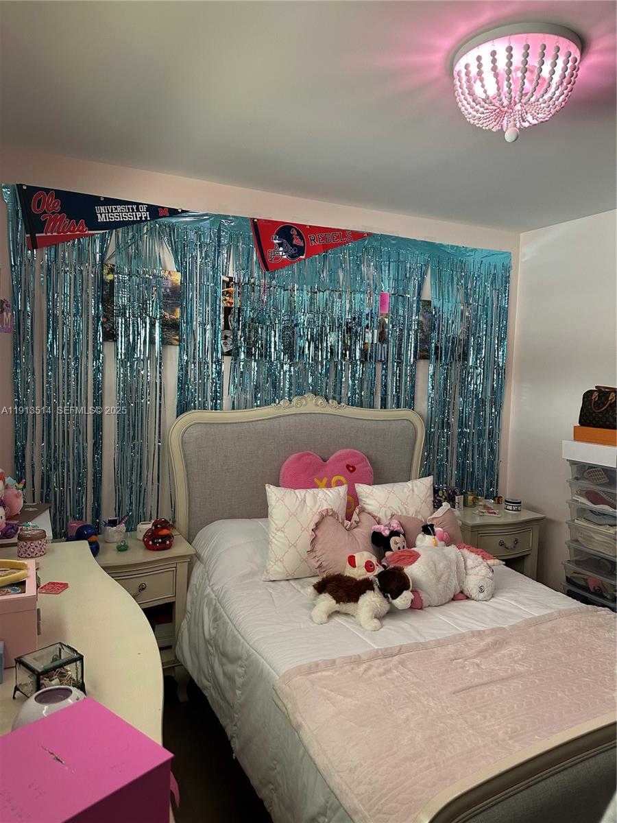 11370 Southwest 113th Terrace Miami, FL 33176 - Photo 17 of 27 a bed room with a bed and a chair