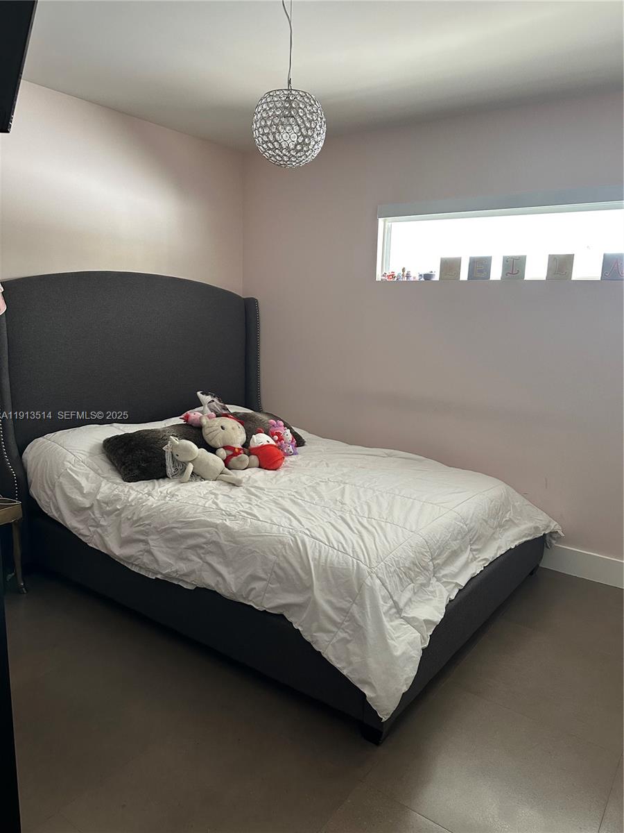 11370 Southwest 113th Terrace Miami, FL 33176 - Photo 18 of 27 a bedroom with a bed and a window