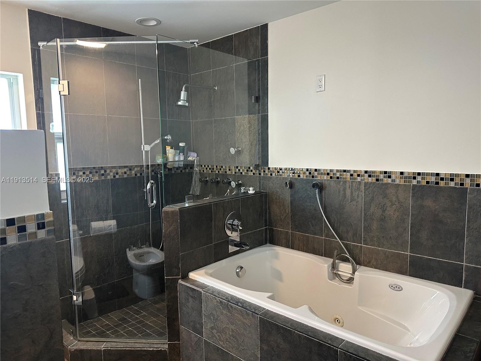 11370 Southwest 113th Terrace Miami, FL 33176 - Photo 21 of 27 a bathroom with a bathtub and a shower