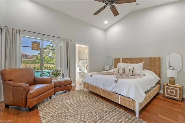 a bedroom with a bed couch and window