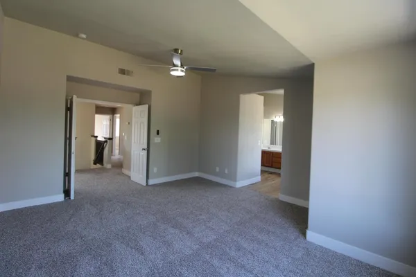 a view of a bathroom with a sink and closet