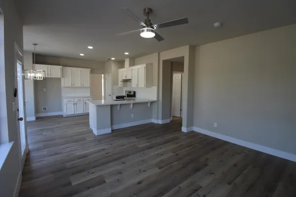 a view of kitchen with wooden floor and window