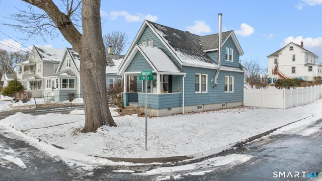a view of a house with a snow in the background