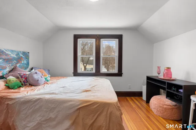 a view of a room with window and wooden floor