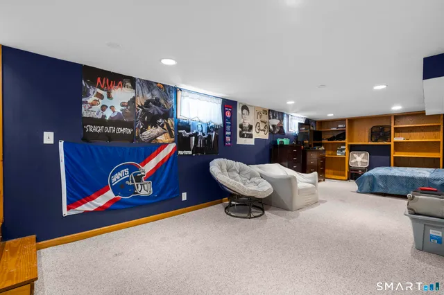 a bedroom with a bed and gym equipment