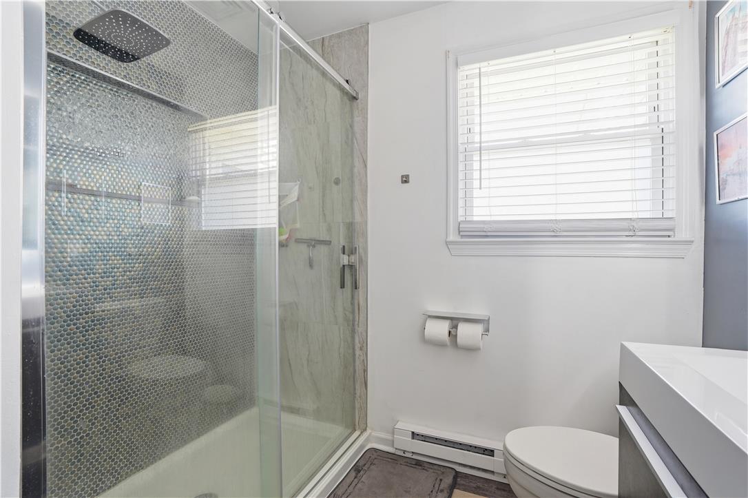 2918 Keystone Street Bethlehem, PA 18020 - Photo 21 of 54 A well-lit bathroom features a glass-enclosed shower and a sleek, contemporary vanity.