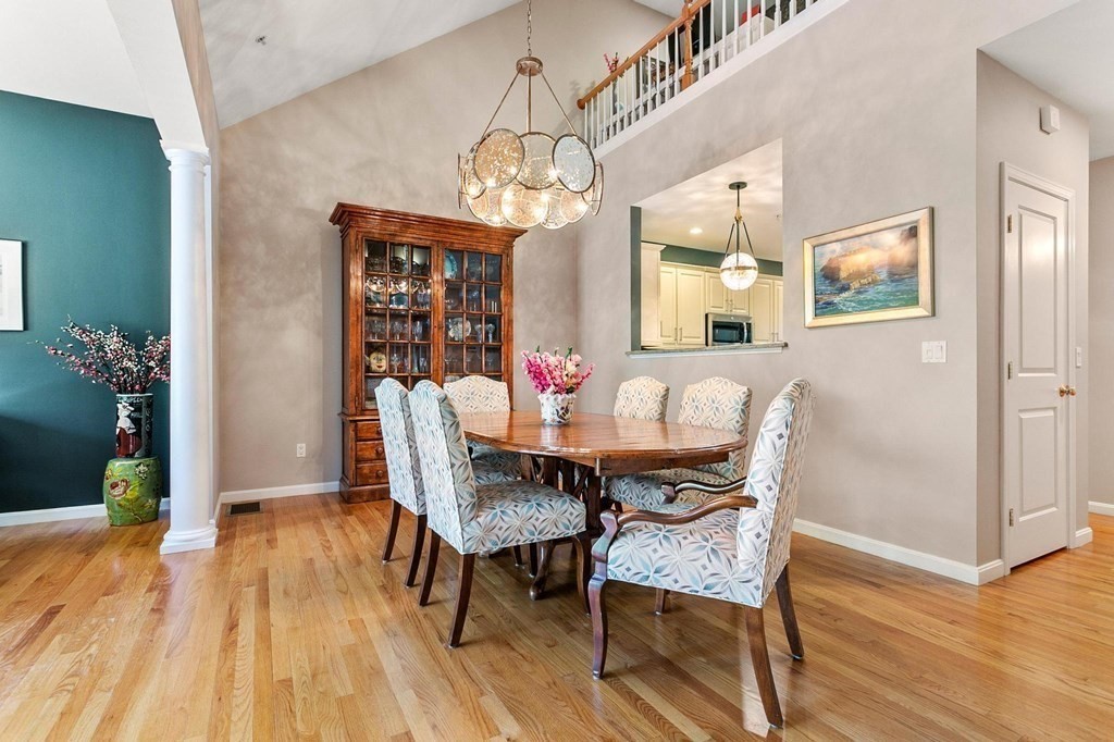 36 Owen Road, Unit 36 Norton, MA 02766 - Photo 11 of 40 a view of a dining room with furniture and wooden floor