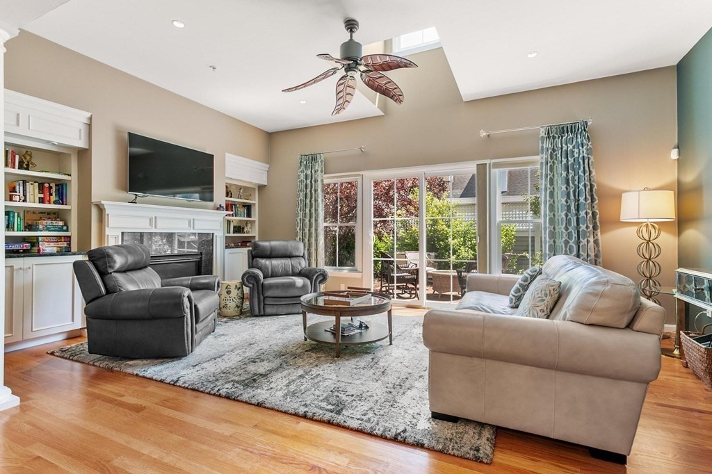 36 Owen Road, Unit 36 Norton, MA 02766 - Photo 13 of 40 a living room with fireplace furniture and a flat screen tv