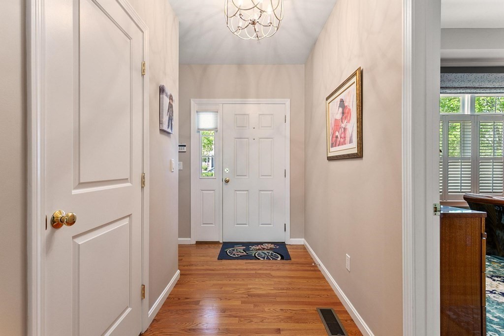 36 Owen Road, Unit 36 Norton, MA 02766 - Photo 15 of 40 a view of a hallway with wooden floor and staircase