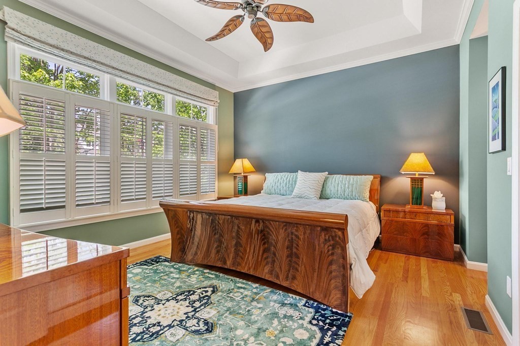 36 Owen Road, Unit 36 Norton, MA 02766 - Photo 17 of 40 a bed sitting in a bedroom next to a window