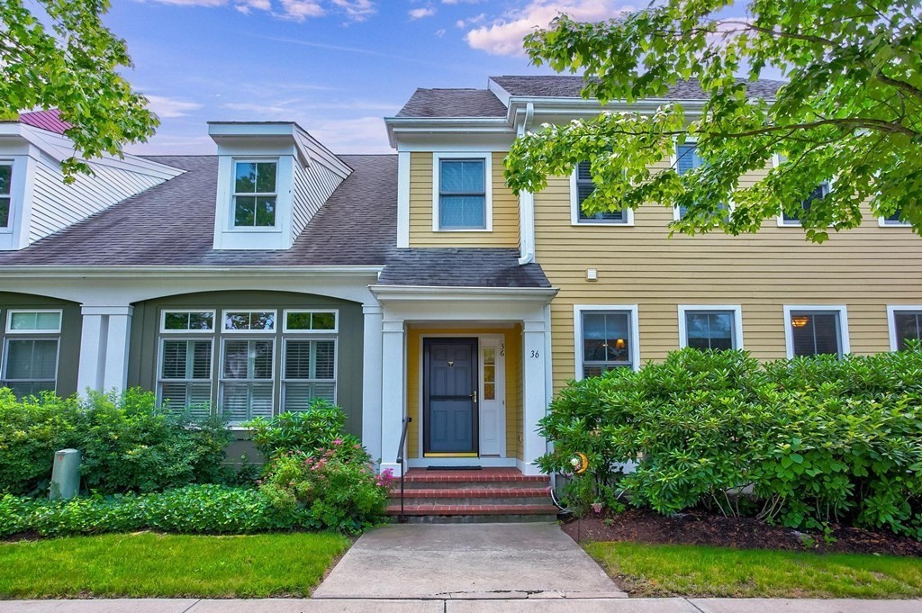 36 Owen Road, Unit 36 Norton, MA 02766 - Photo 2 of 40 a front view of a house with yard and green space