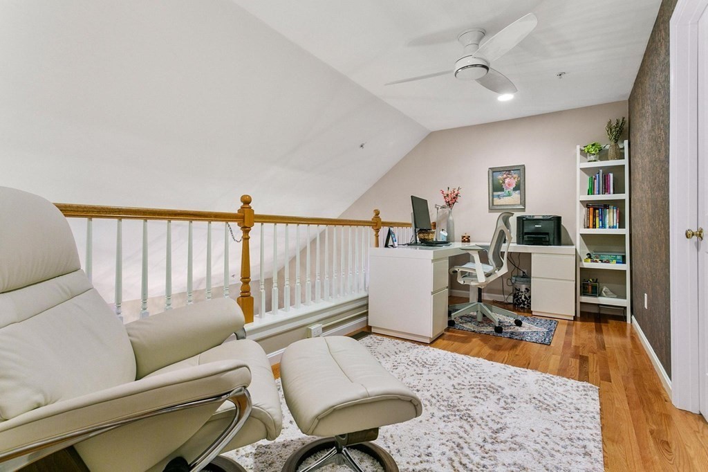 36 Owen Road, Unit 36 Norton, MA 02766 - Photo 23 of 40 a workspace with furniture and wooden floor