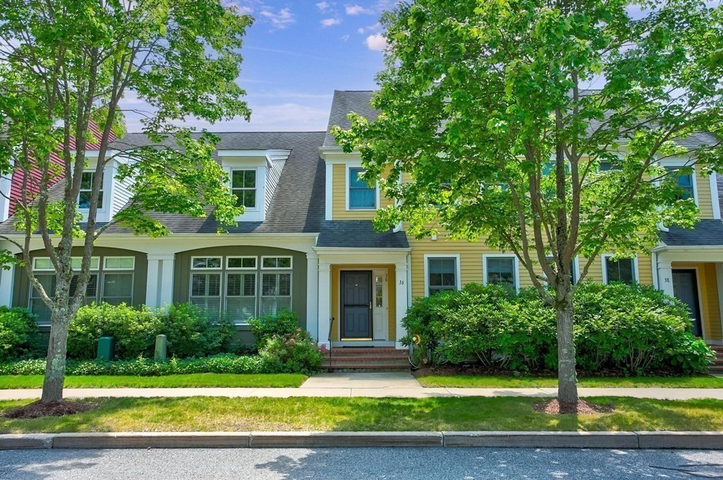 36 Owen Road, Unit 36 Norton, MA 02766 - Photo 31 of 40 a front view of a house with a yard and garage