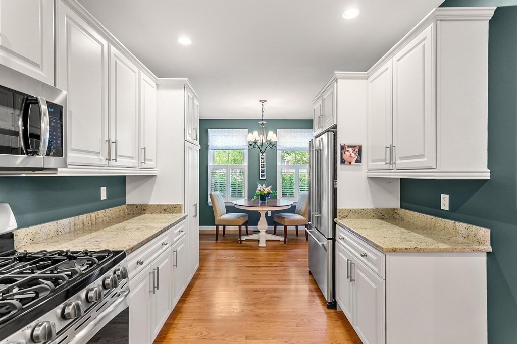 36 Owen Road, Unit 36 Norton, MA 02766 - Photo 7 of 40 a kitchen with stainless steel appliances granite countertop a stove and a sink