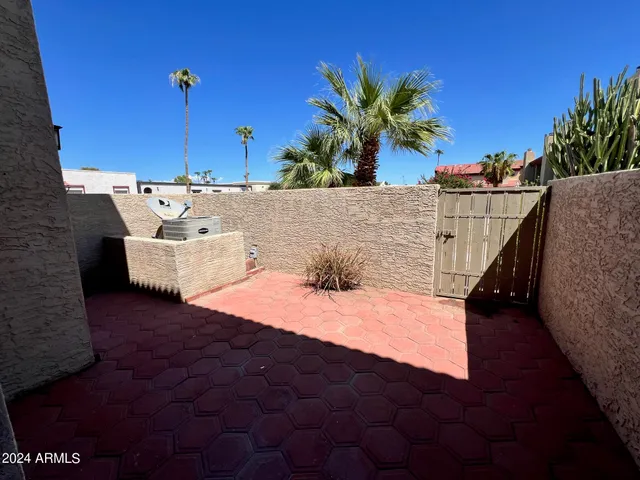 a view of a swimming pool with a lounge chairs