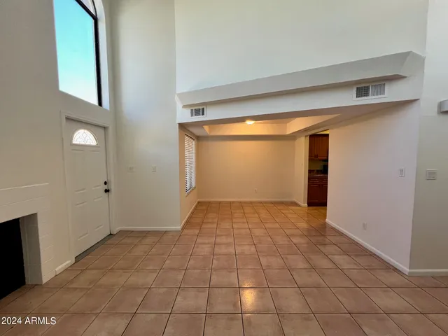 a view of a livingroom with a ceiling fan and window