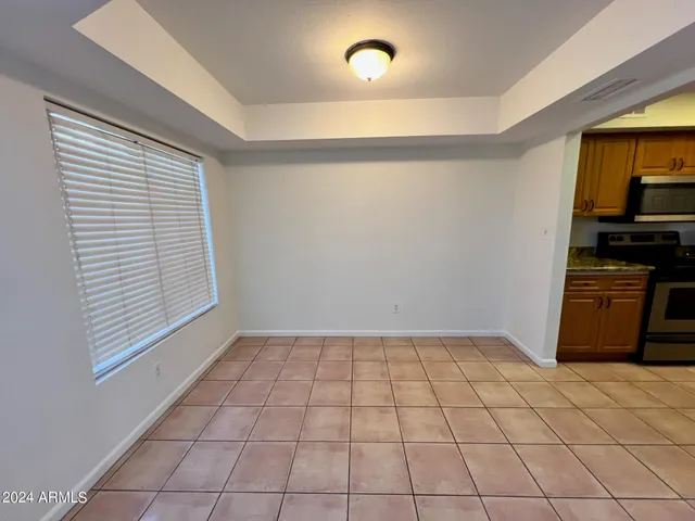 a view of an empty room and a window