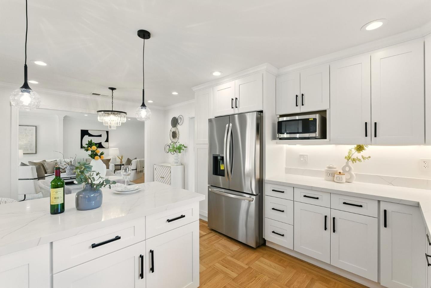 1807 Hunt Drive Burlingame, CA 94010 - Photo 19 of 46 a kitchen with white cabinets and stainless steel appliances