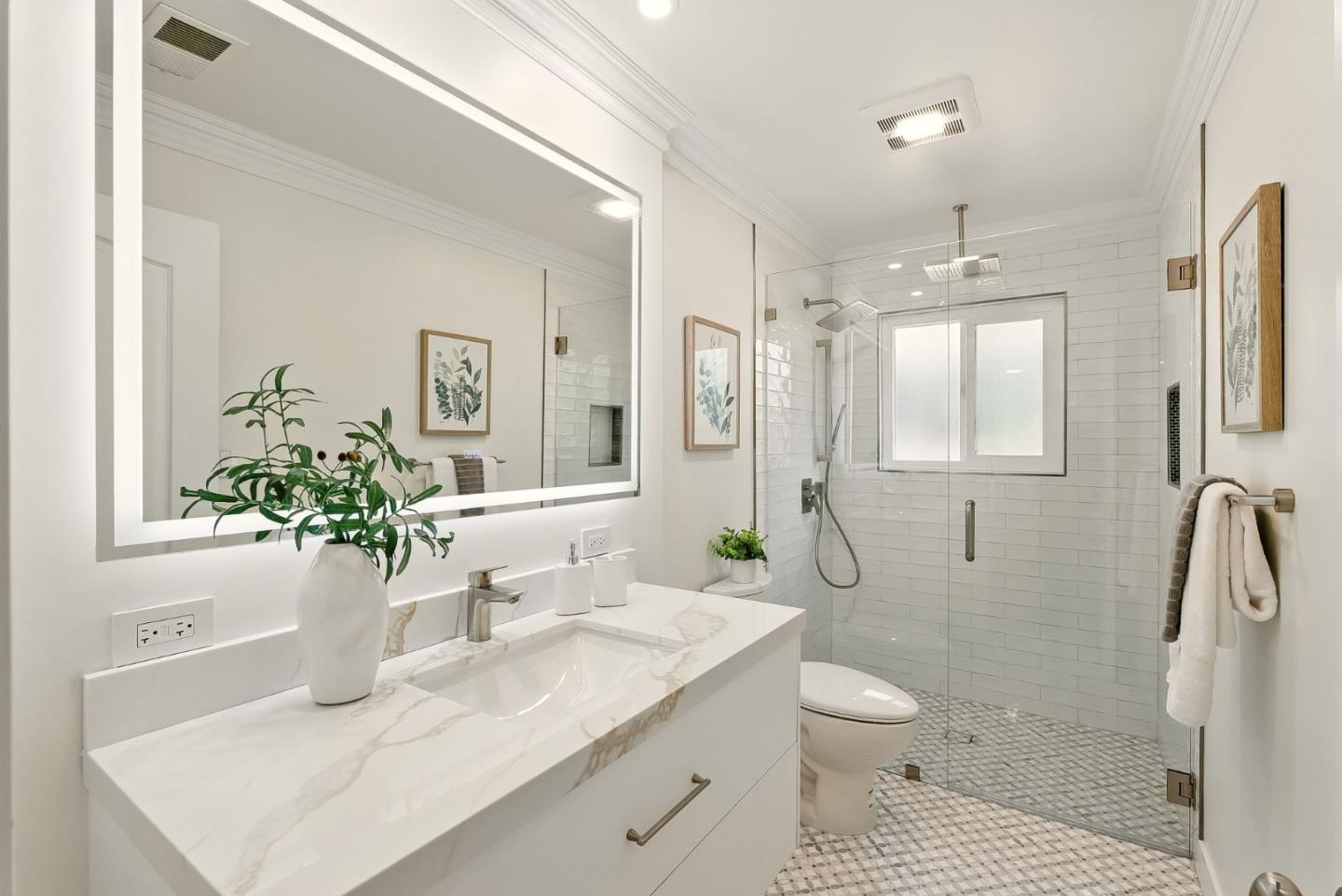 1807 Hunt Drive Burlingame, CA 94010 - Photo 26 of 46 a bathroom with a granite countertop sink a toilet and shower