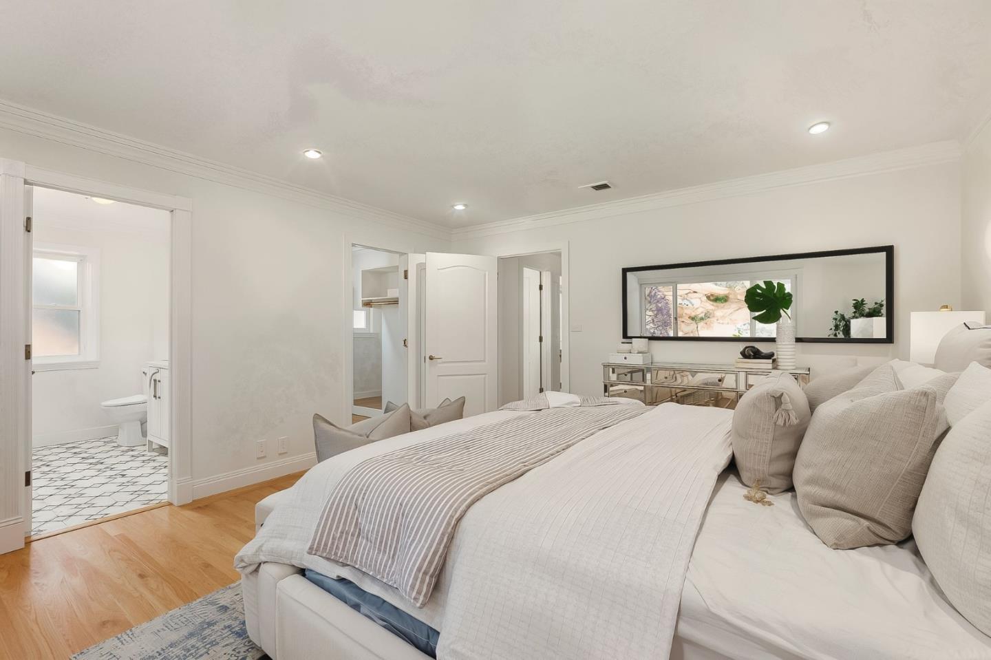 1807 Hunt Drive Burlingame, CA 94010 - Photo 28 of 46 a spacious bedroom with a bed and wooden floor