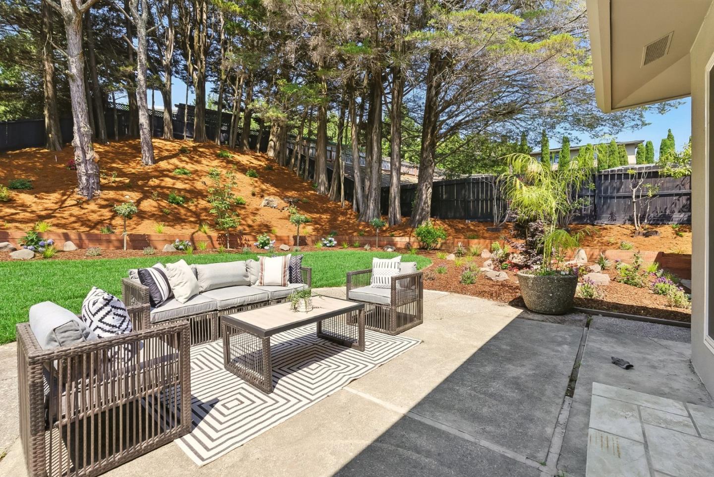 1807 Hunt Drive Burlingame, CA 94010 - Photo 35 of 46 a view of a patio with couches table and chairs and potted plants