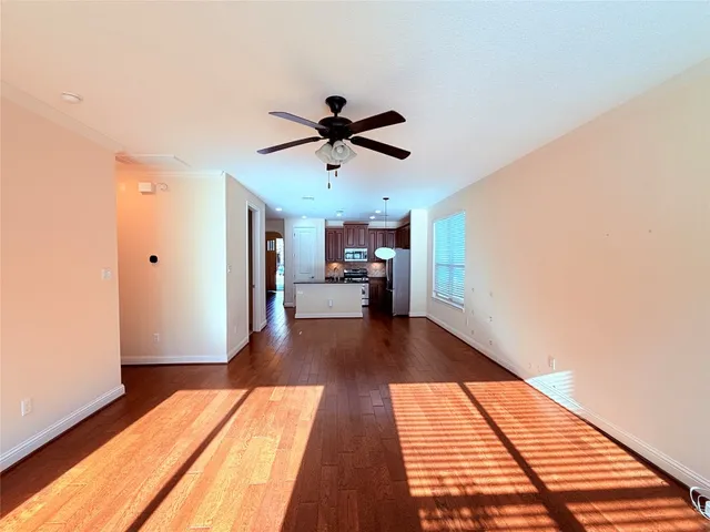 a view of a living room with wooden floor