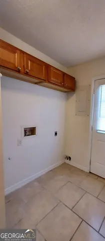 a view of a storage & utility room with closet