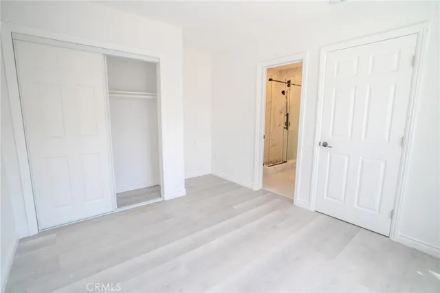 a bathroom with a double vanity sink mirror and shower