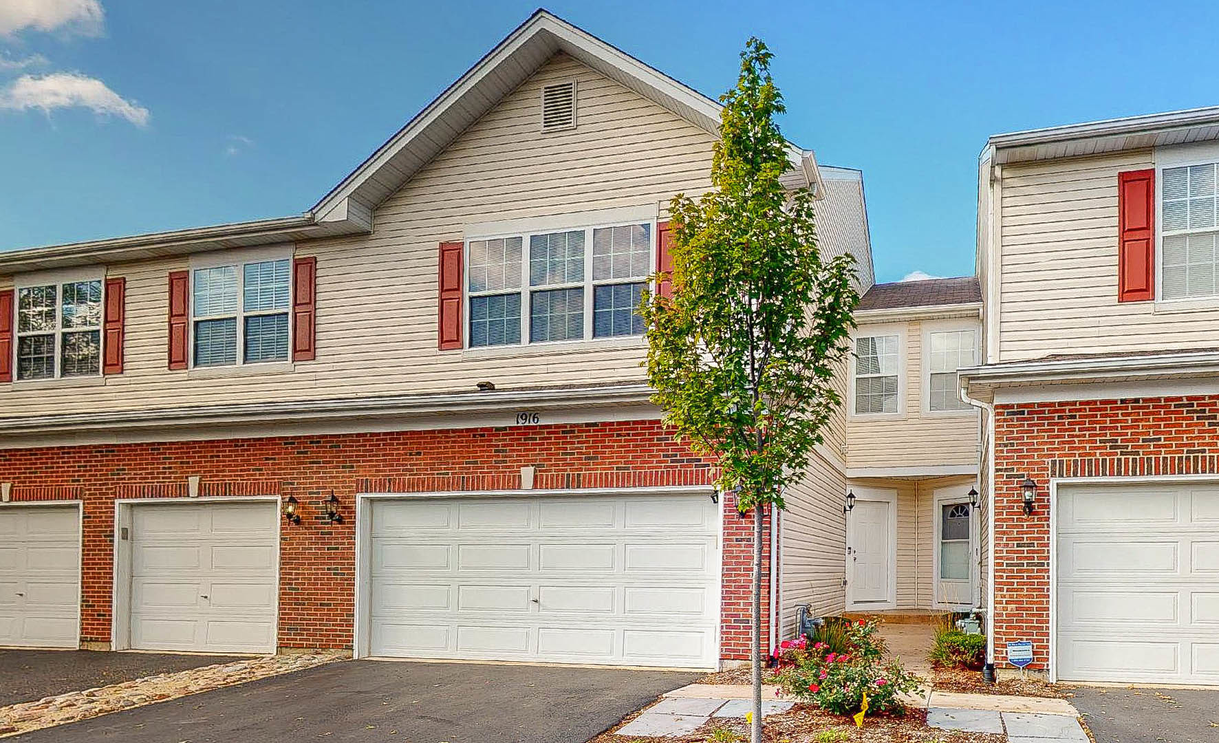 1916 West Cobblestone Road Romeoville, IL 60446 - Photo 1 of 21 a house that has a tree in front of the house