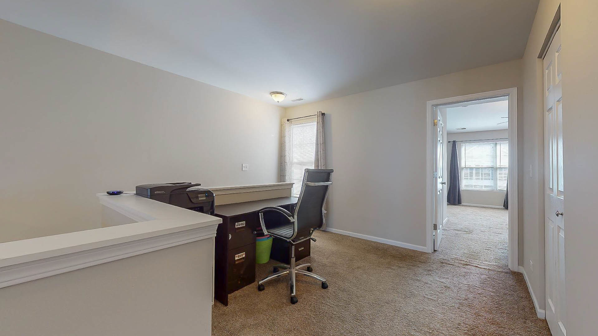 1916 West Cobblestone Road Romeoville, IL 60446 - Photo 16 of 21 a room with a desk and chandelier
