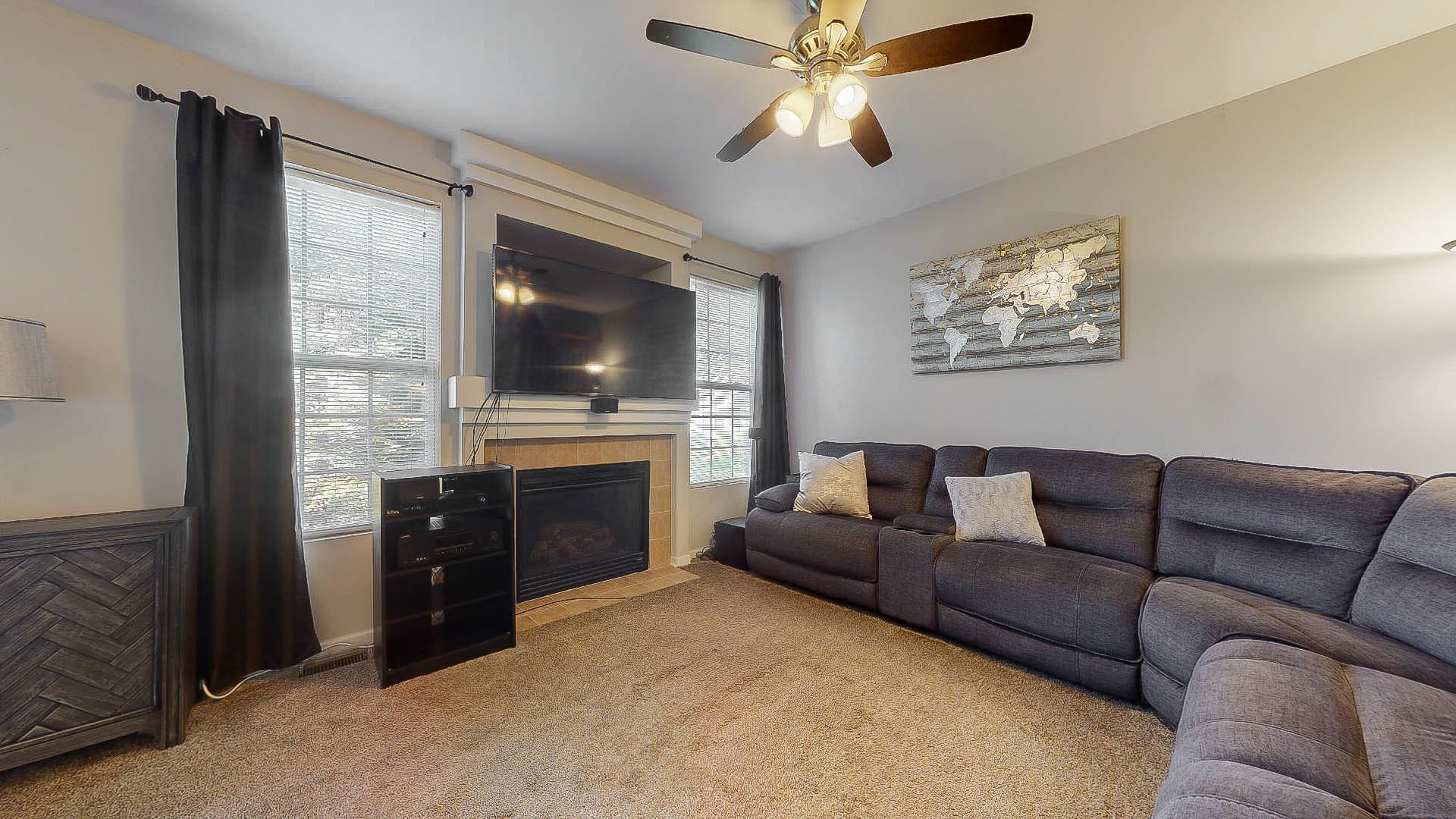 1916 West Cobblestone Road Romeoville, IL 60446 - Photo 3 of 21 a living room with furniture and a flat screen tv