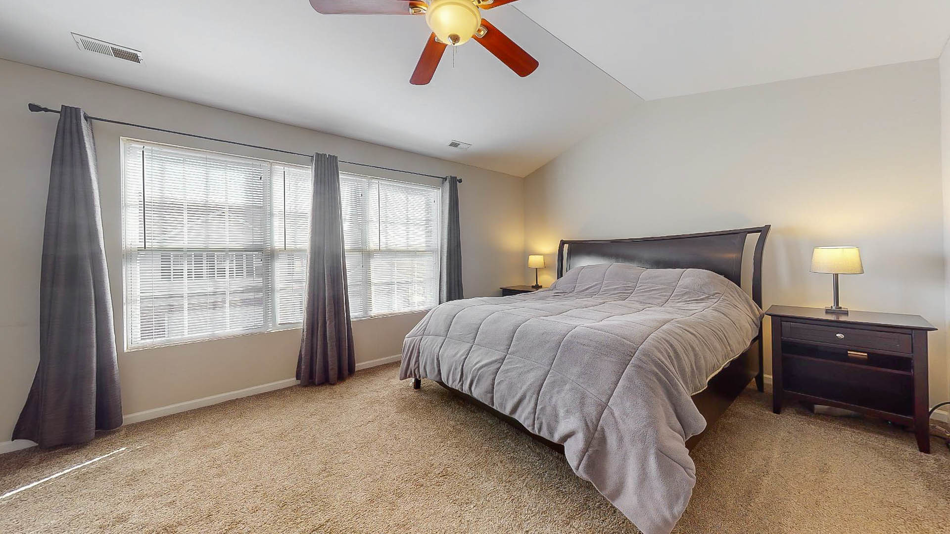 1916 West Cobblestone Road Romeoville, IL 60446 - Photo 10 of 21 a spacious bedroom with a bed and a large window