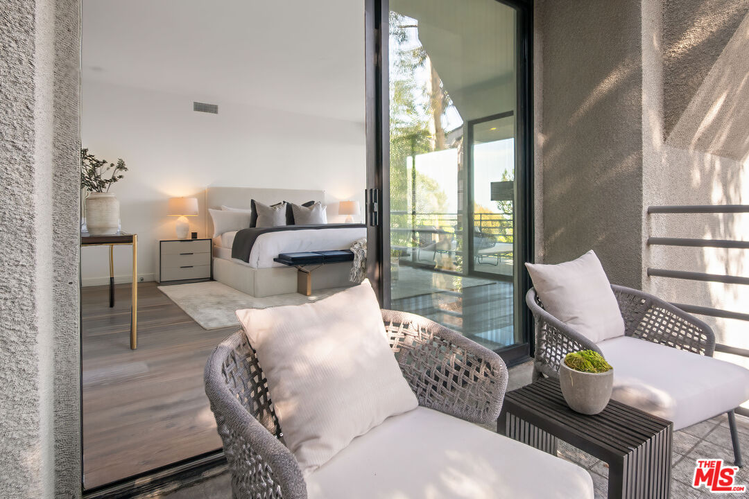 1500 Inverness Drive Pasadena, CA 91103 - Photo 41 of 66 a living room with furniture and a floor to ceiling window