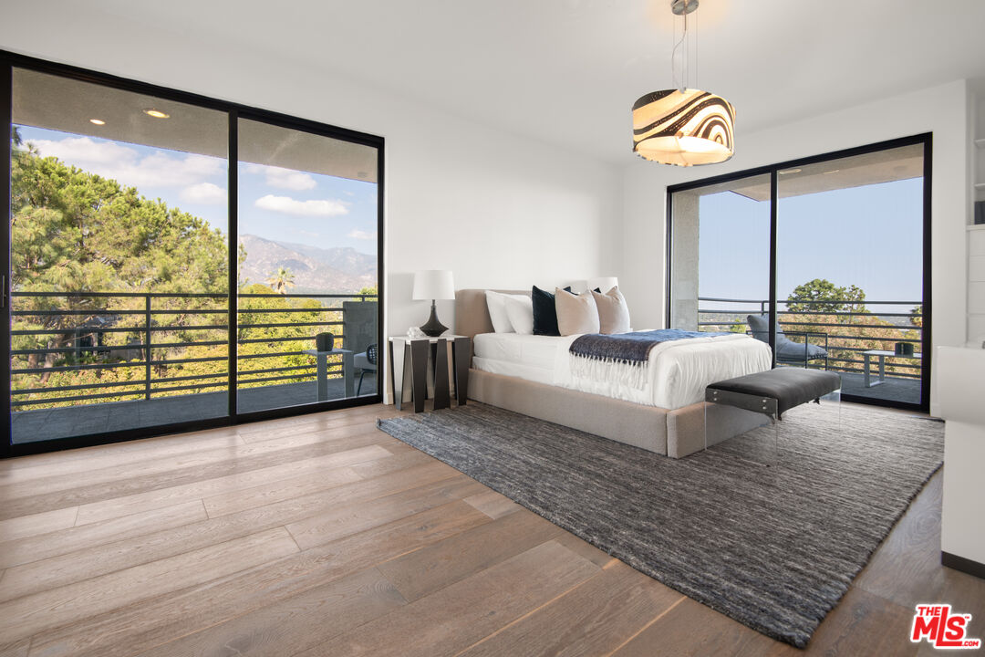 1500 Inverness Drive Pasadena, CA 91103 - Photo 44 of 66 a living room with furniture and a floor to ceiling window