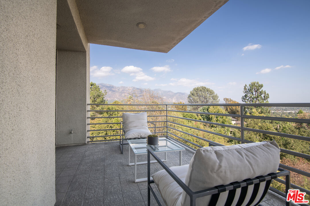 1500 Inverness Drive Pasadena, CA 91103 - Photo 45 of 66 a view of a balcony with table and chairs