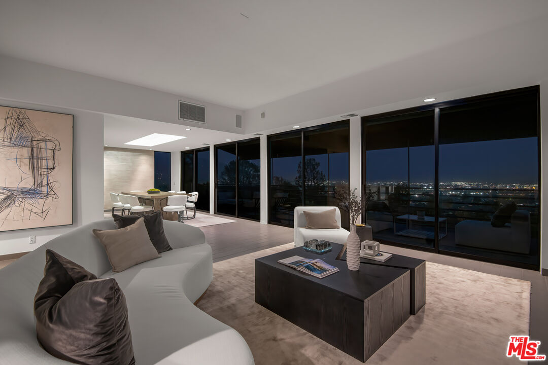 1500 Inverness Drive Pasadena, CA 91103 - Photo 59 of 66 a living room with furniture coffee table and a floor to ceiling window