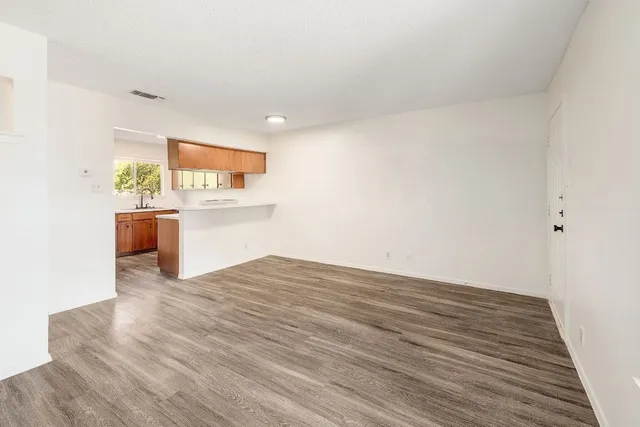 a view of kitchen and wooden floor