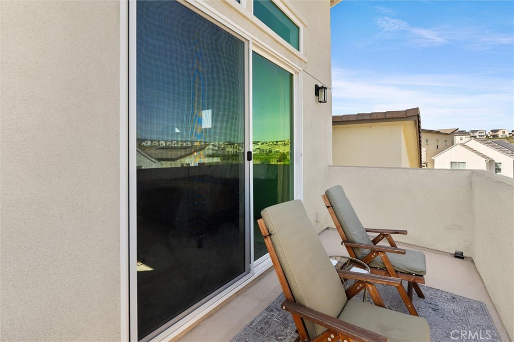 540 Sparrowhawk Way Rancho Mission Viejo, CA 92694 - Photo 22 of 54 a view of a balcony with chair and table