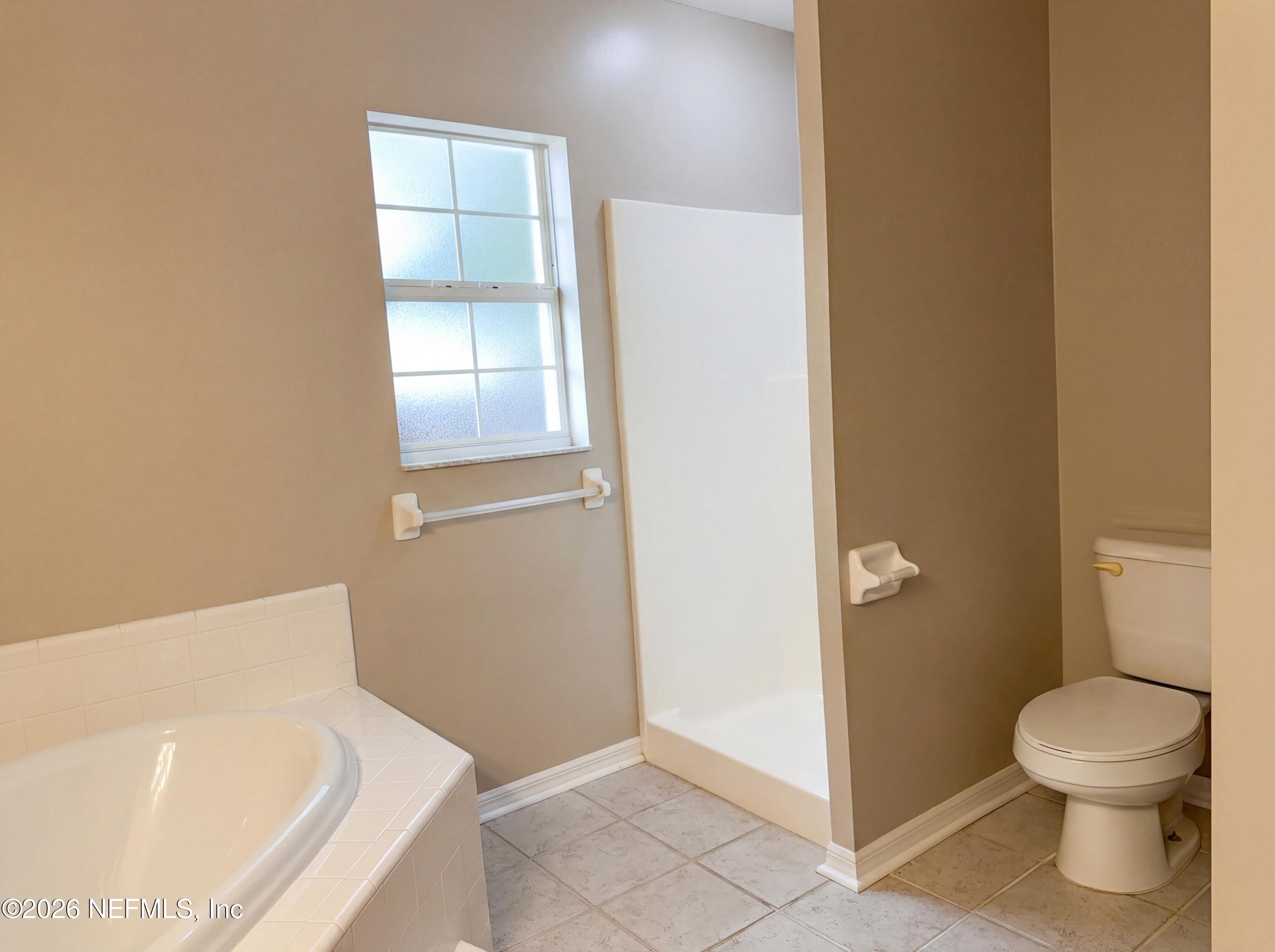 7628 Alameda Way Keystone Heights, FL 32656 - Photo 20 of 29 a bathroom with a toilet and a sink