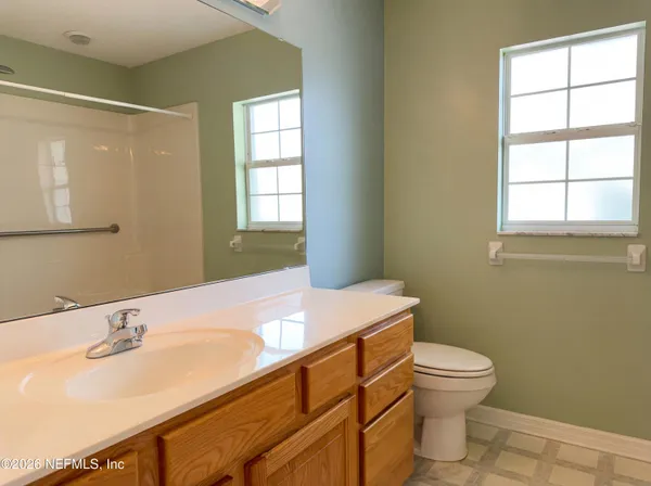 a bathroom with a sink toilet and vanity