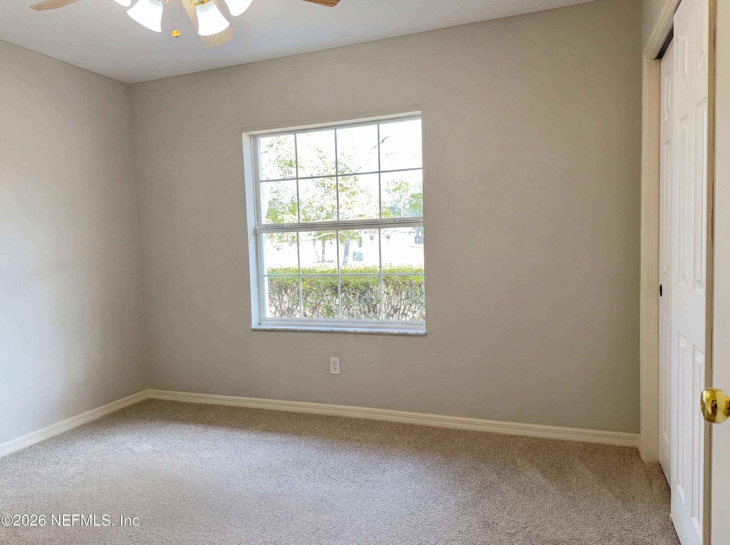 7628 Alameda Way Keystone Heights, FL 32656 - Photo 25 of 29 an empty room with a window