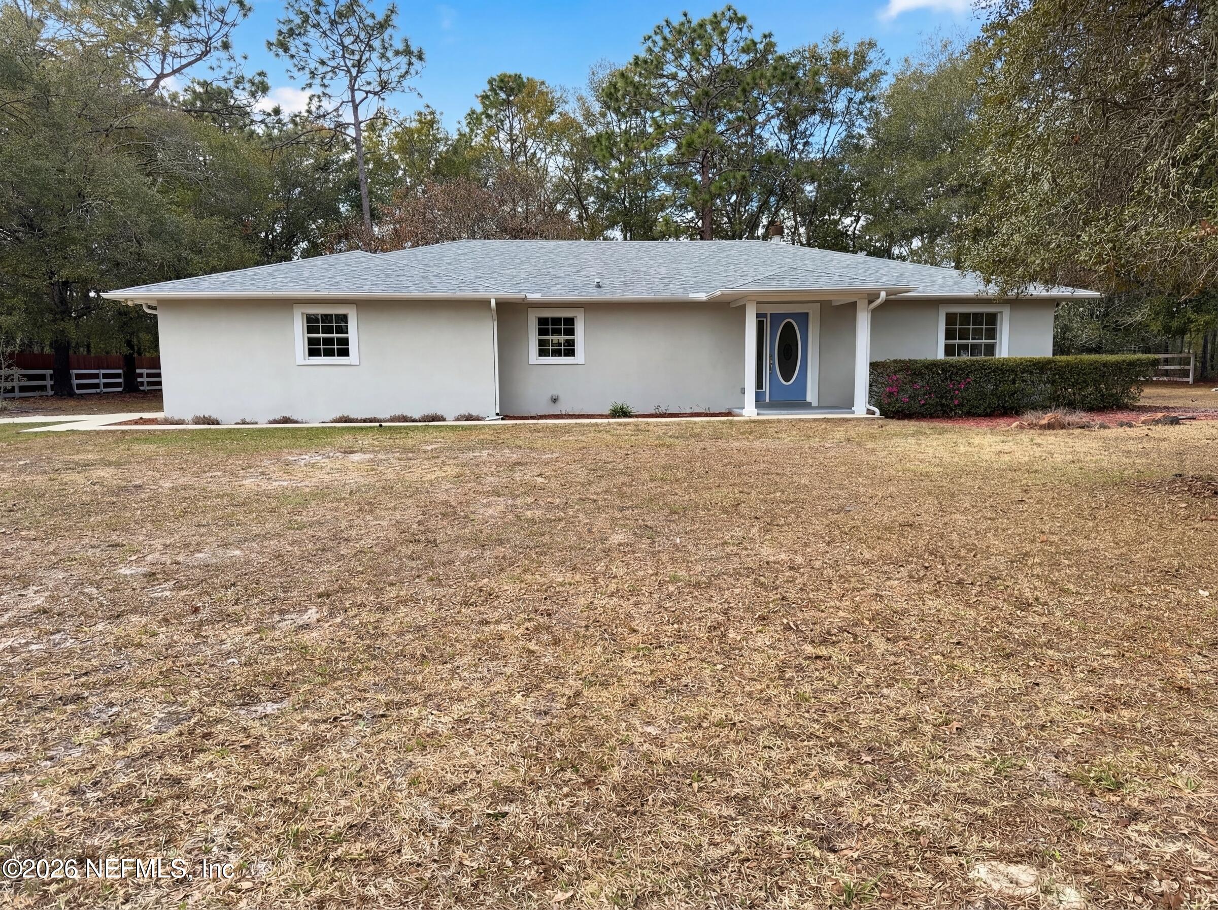 7628 Alameda Way Keystone Heights, FL 32656 - Photo 7 of 29 front view of house with a yard