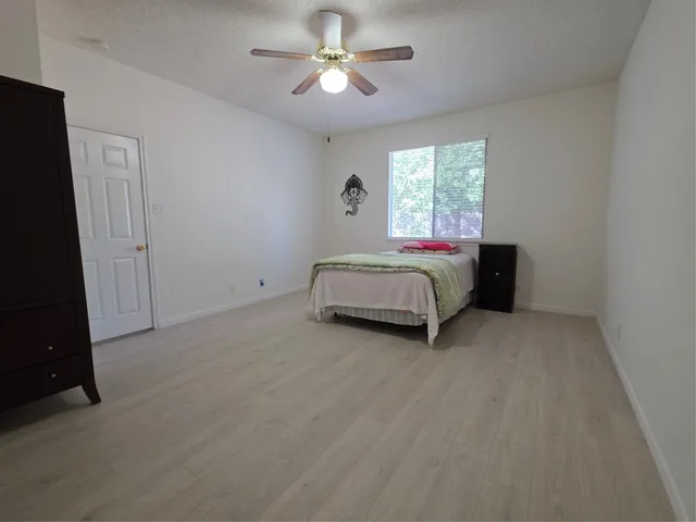 a bed room with a bed and a window