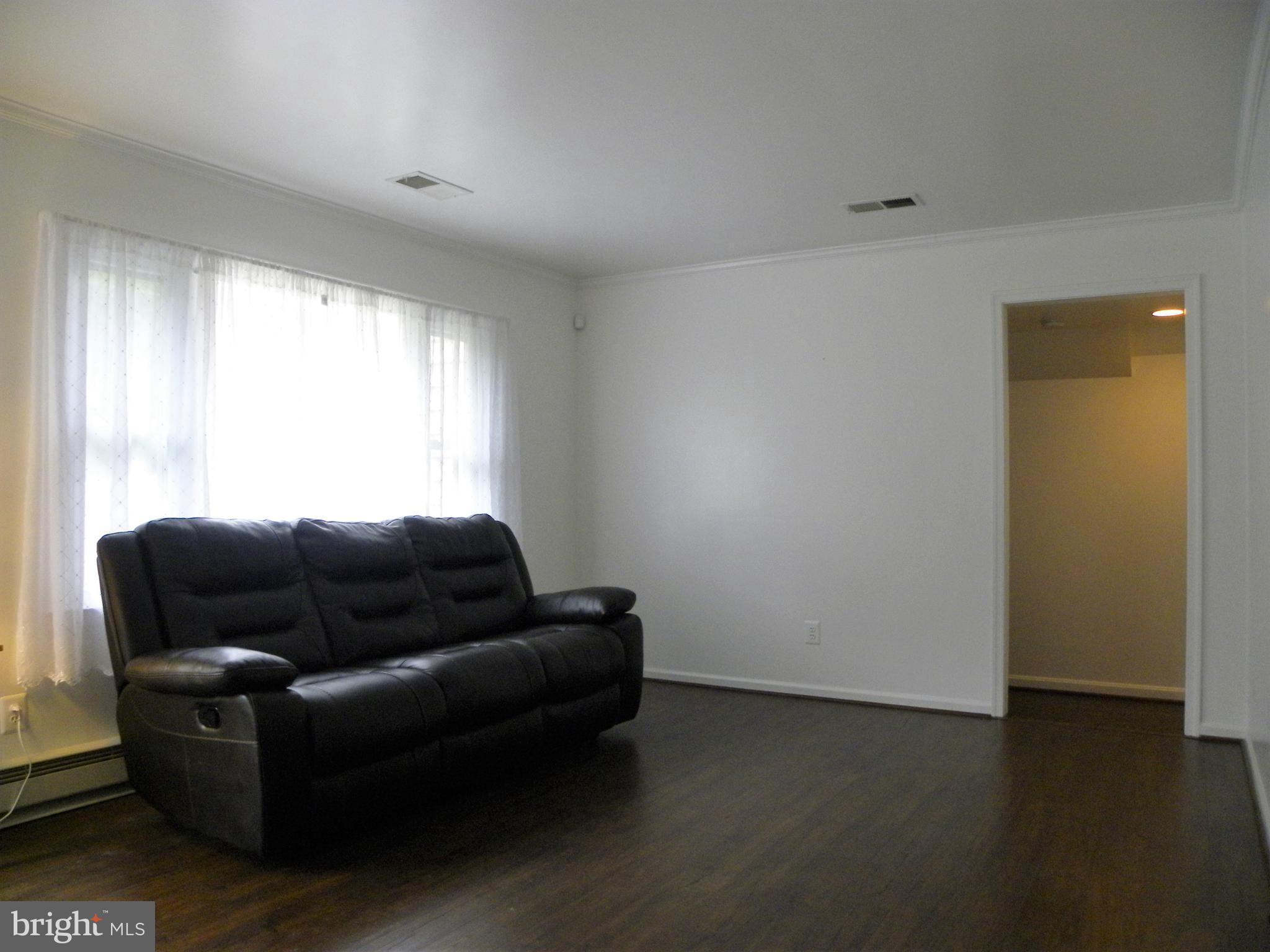 7415 Bull Run Road Manassas, VA 20111 - Photo 13 of 30 a living room with furniture and a window