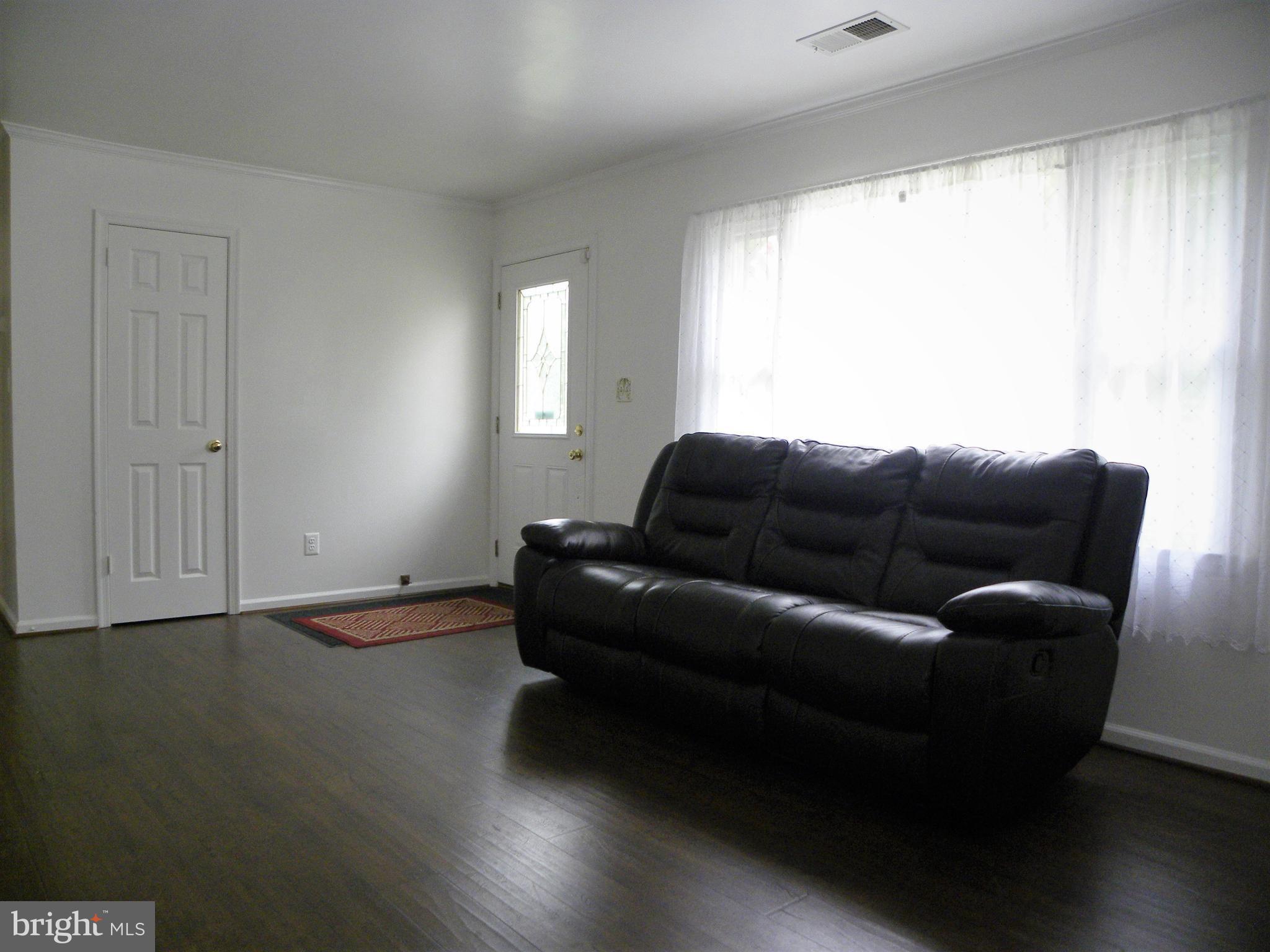 7415 Bull Run Road Manassas, VA 20111 - Photo 17 of 30 a living room with furniture and a window