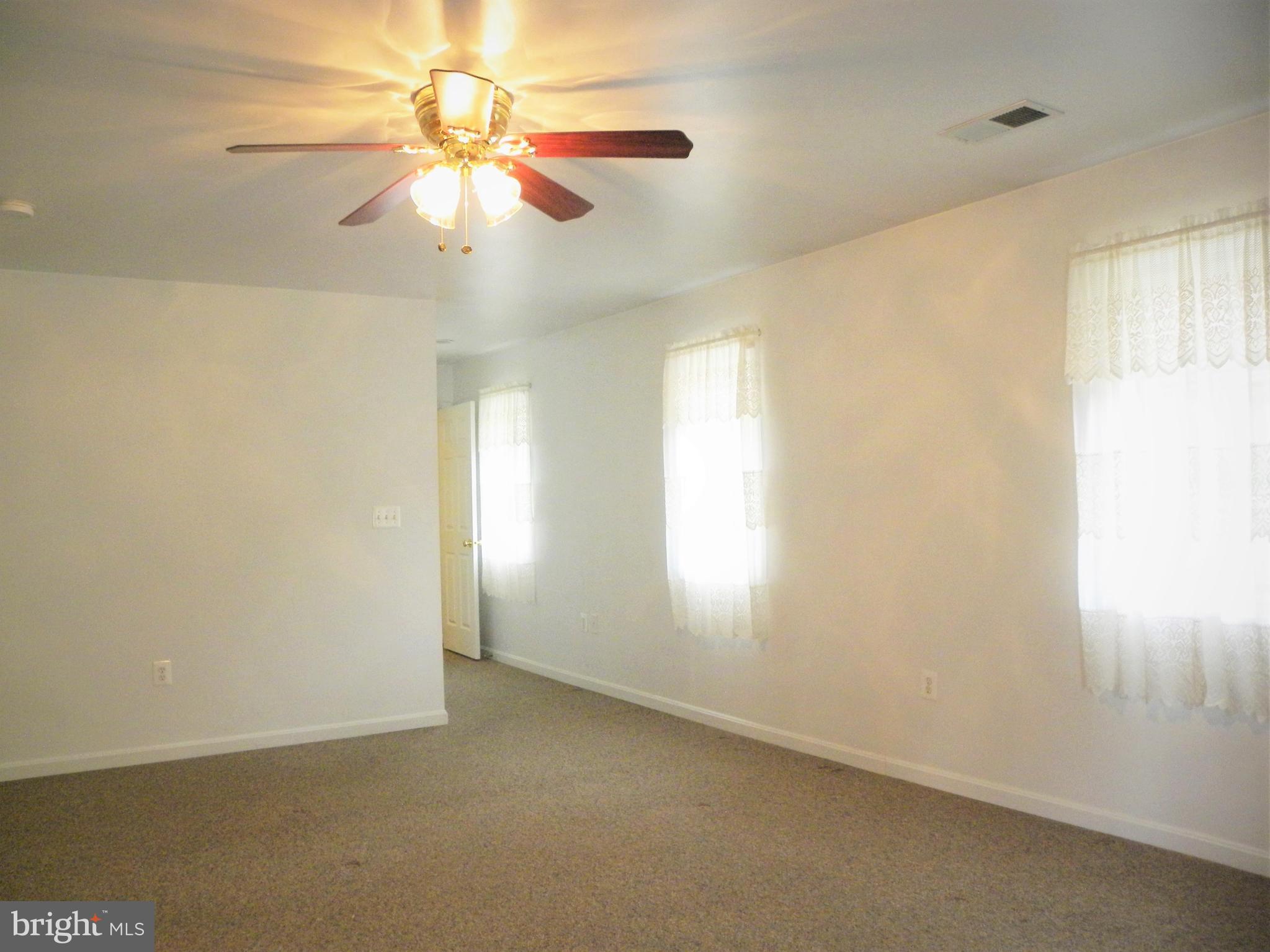 7415 Bull Run Road Manassas, VA 20111 - Photo 27 of 30 an empty room with windows and fan