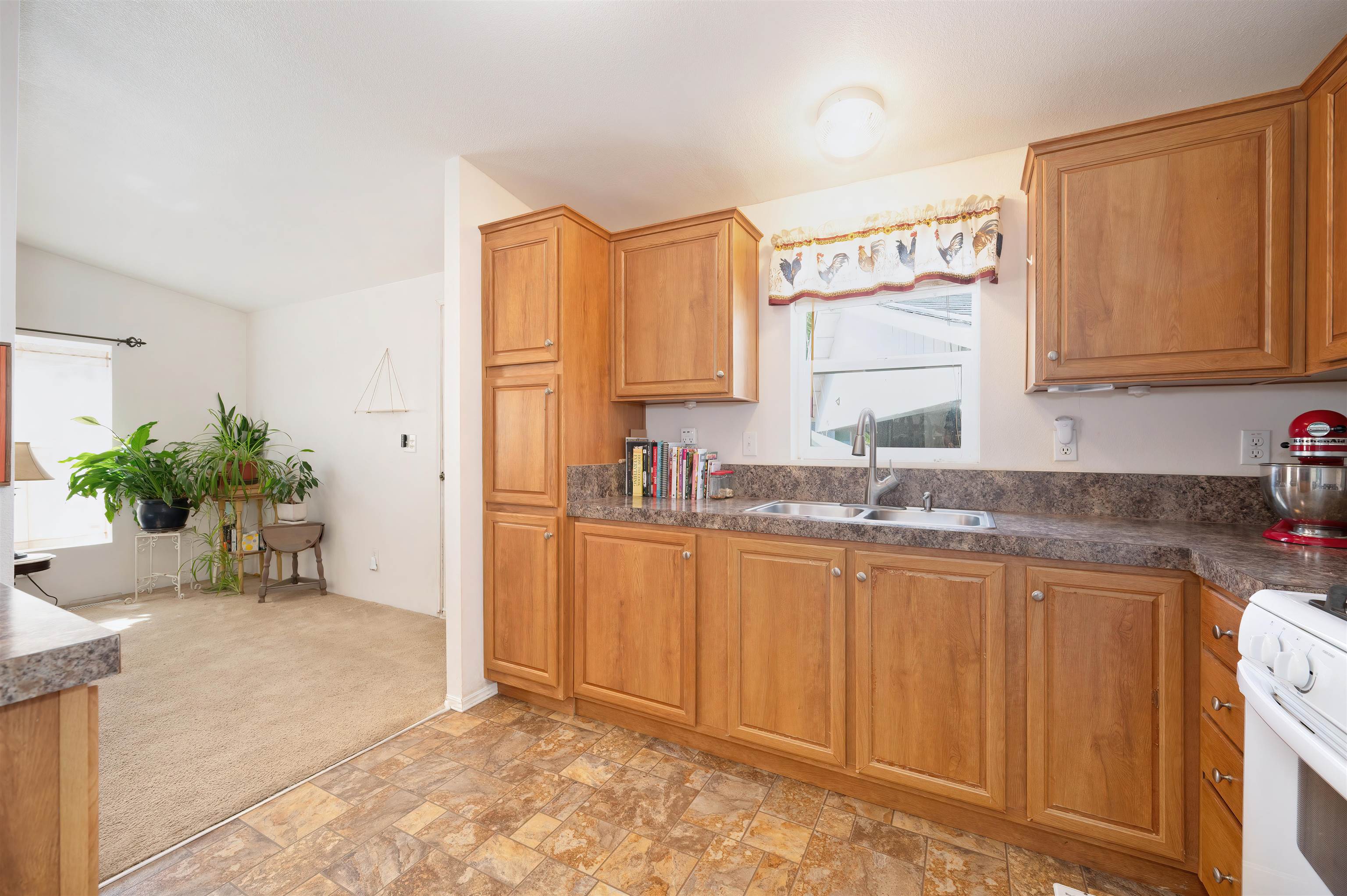 1080 Julie Lane, Unit 255 South Lake Tahoe, CA 96150 - Photo 11 of 26 a bathroom with a granite countertop sink and a mirror